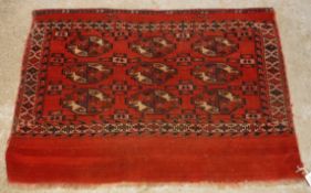 A Bokhara tribal rug, the main panel set