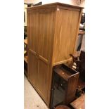 A modern oak two door wardrobe in the Ar