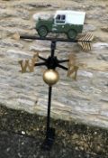 A cast metal weather vane with Landrover