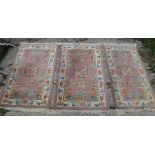 A set of three Chinese rugs, the central