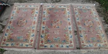 A set of three Chinese rugs, the central