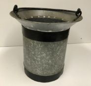 A small bucket with swing handle and bev