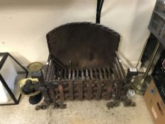 A cast iron fire basket with integral ba