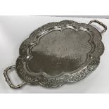 A circa 1900 Chinese silver shaped oval tray with central inscription "CEG" within an oval,