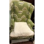 An early 20th Century wingback scroll ar