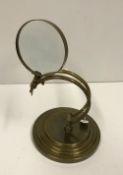A modern brass table magnifying glass, 2