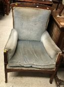 A late Victorian oak framed upholstered