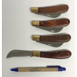 Four various wooden handled folding kniv