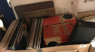 A box containing various LPs and 45s, to