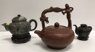 A Chinese Yi Xing teapot with figural de