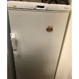 A John Lewis upright freezer, 60 cm wide