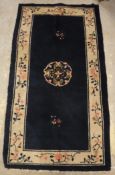 A circa 1920's Chinese rug, the central