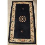 A circa 1920's Chinese rug, the central