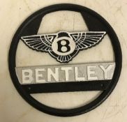 A modern painted cast metal sign "Bentle