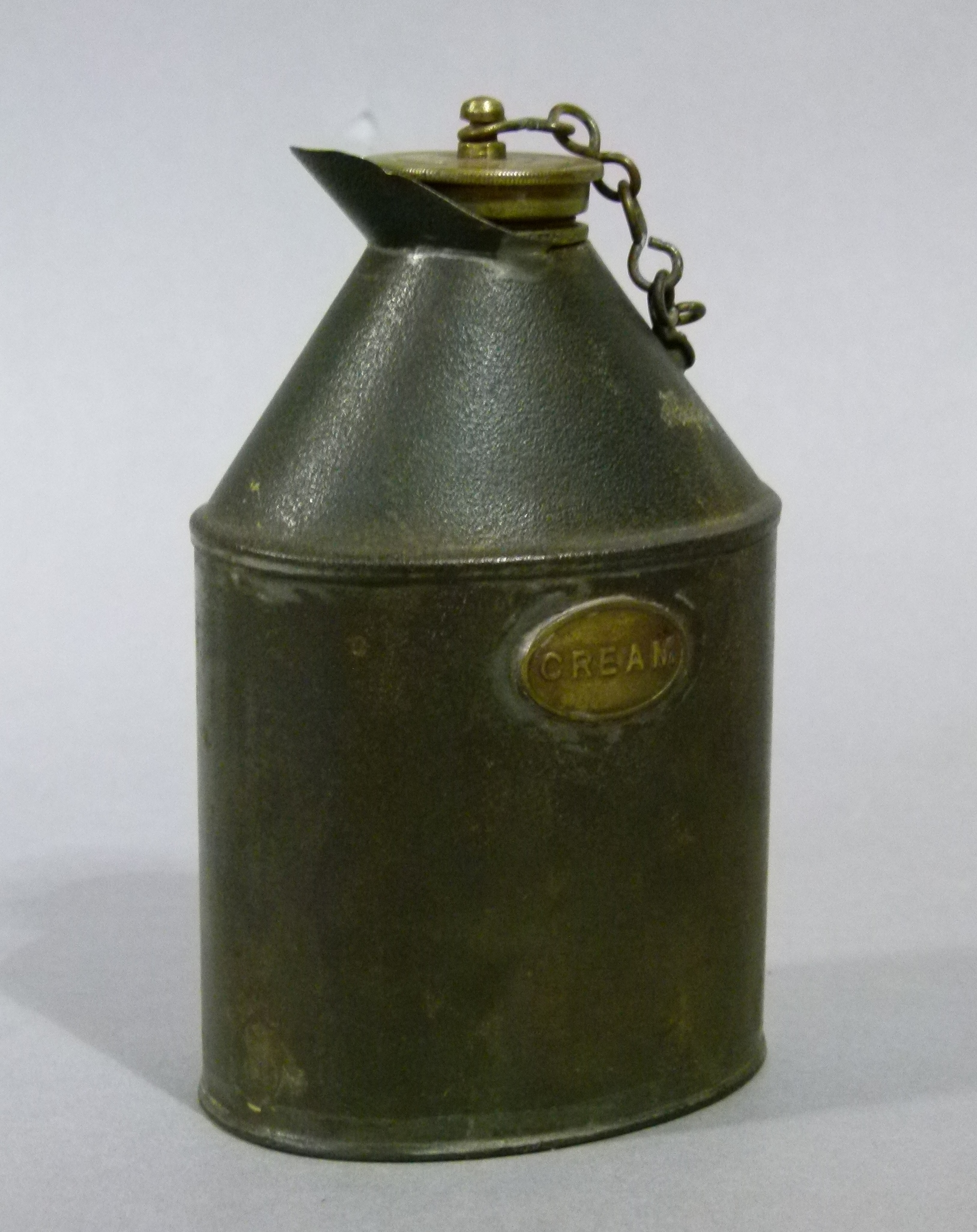 A metal cream flask with crew down brass cover the oval body applied brass label inscribed cream, - Image 2 of 2