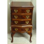 A reproduction mahogany serpentine fronted miniature chest on stand, the figured top with