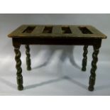 A Victorian stained pine luggage stand of rounded rectangular form, slatted top above barley