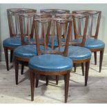 A set of six late 19th century mahogany framed dining chairs the concave railed backs carved with