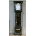 A reproduction battery operated long case clock of ornate design, bearing label for Frederick