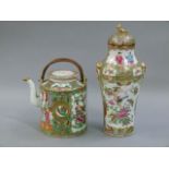 A Cantonese famille rose cylindrical tea kettle and cover decorated with panels of figures,
