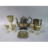 A quantity of silver plated ware including fluted melon shaped teapot, egg cups, tankard, goblet and