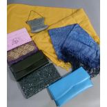 Five various clutch bags and a 'smocked' evening bag; together with a yellow wool shawl by Jaeger