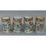 A pair of Cantonese famille rose moulded cylindrical vases each with pair of panels of figures in