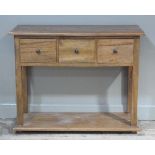 A reproduction elm dresser base the rectangular top above three deep drawers on square legs with