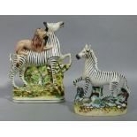 A Staffordshire flat back figure of a zebra with lion jockey, c.1874 from Barnum and Bailey