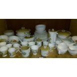 A quantity of Susie Cooper sunflower pattern dinner ware