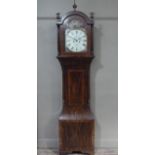 A 19th century mahogany cross banded long case clock, having an arched dial painted with classical