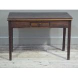 A George III oak foldover tea table the frieze fitted with single drawer, square tapered legs,