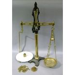 A set of Victorian beam scales by W & T Avery Ltd, the cylindrical brass post with foliate scroll