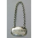 A 19th century silver bottle label of elongated reeded octagonal form engraved 'Anchovy', silver