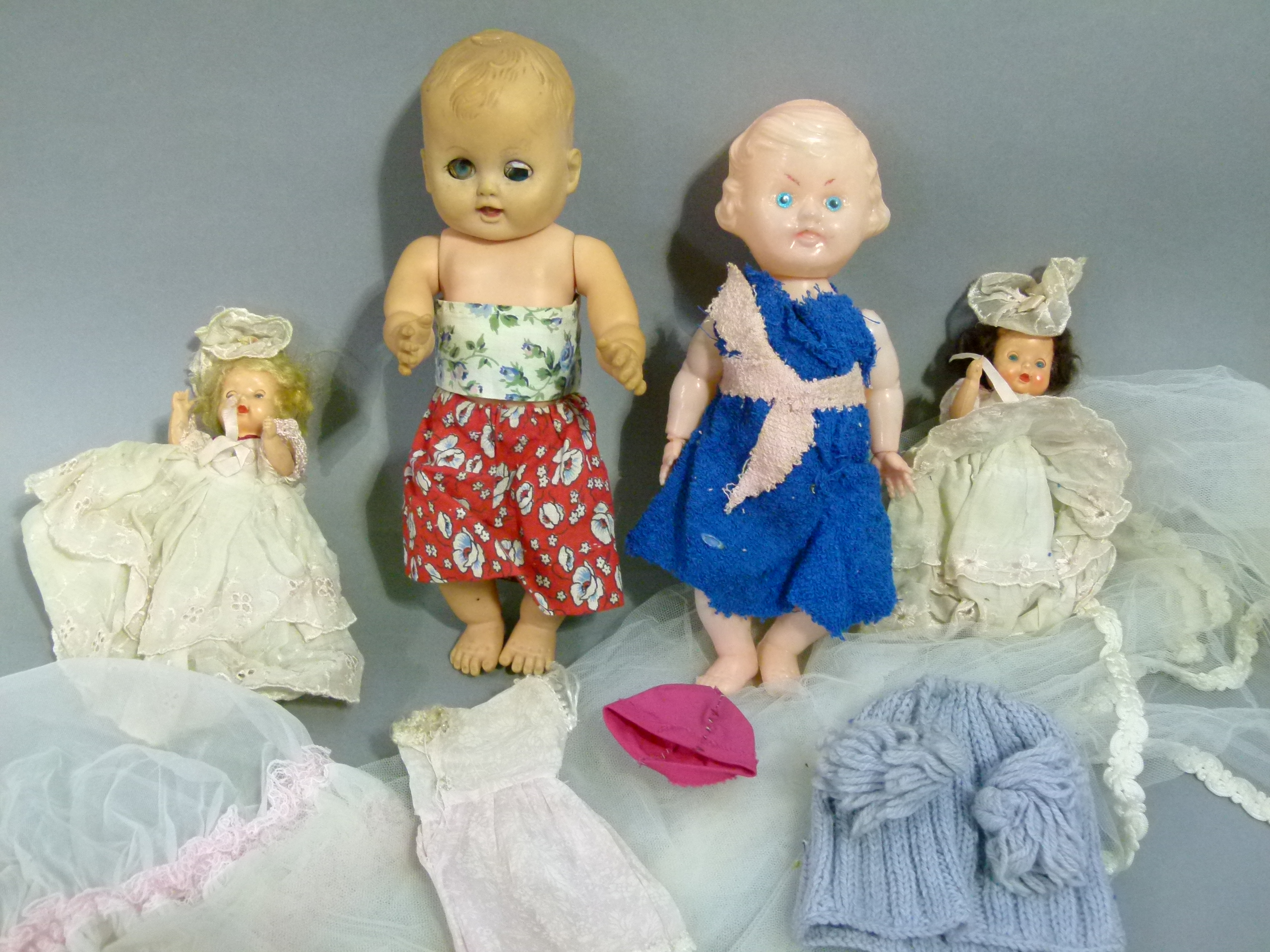 A small quantity of celluloid dolls in costume