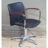 A black and red vinyl upholstered office chair on metal star base