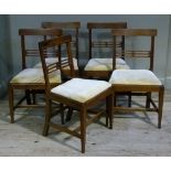 A set of five George III mahogany dining chairs the concave cresting rails boxwood strung and inlaid