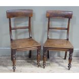A pair of Victorian fruitwood dining chairs with concave panel backs, above concave horizontal rails