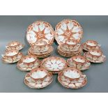 A Victorian tea service comprising ten tea plates, two bread and butter plates, eleven saucers and