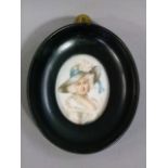 An 18th century style oval head and shoulder portrait miniature of a young woman wearing a feather