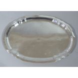 A continental silver coloured metal oval tray engraved to the field with signatures, 29cm wide,