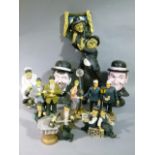 A quantity of resin and plastic figures, head and shoulder busts of Laurel & Hardy