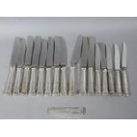 A set of silver handled knives with stainless steel blades (a/f)
