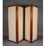 An early Victorian mahogany framed four fold screen inset with beige cotton damask panels, rule