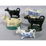 Five Victorian and later cow creamers