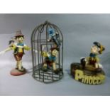 Three Pinocchio plastic and resin figurines