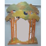 A modern decorative mirror, the fret carved frame modelled as an open glade, the trees stained green