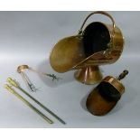 A Victorian copper coal hod with shovel; together with two pokers, etc