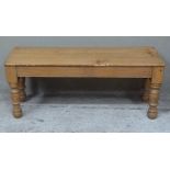A Victorian style pine stool, rectangular top above turned legs, 102cm wide