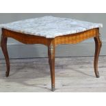 A reproduction mahogany stained beech occasional table with serpentine shaped marble top, the